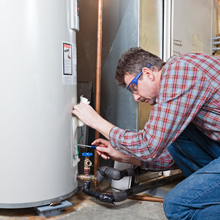 A man fixing the water heater
